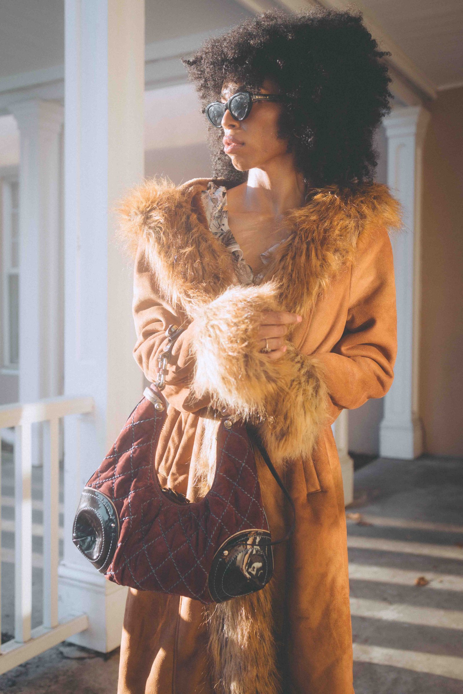 bohemian lifestyle fashion portrait with vintage fur coat and warm golden light