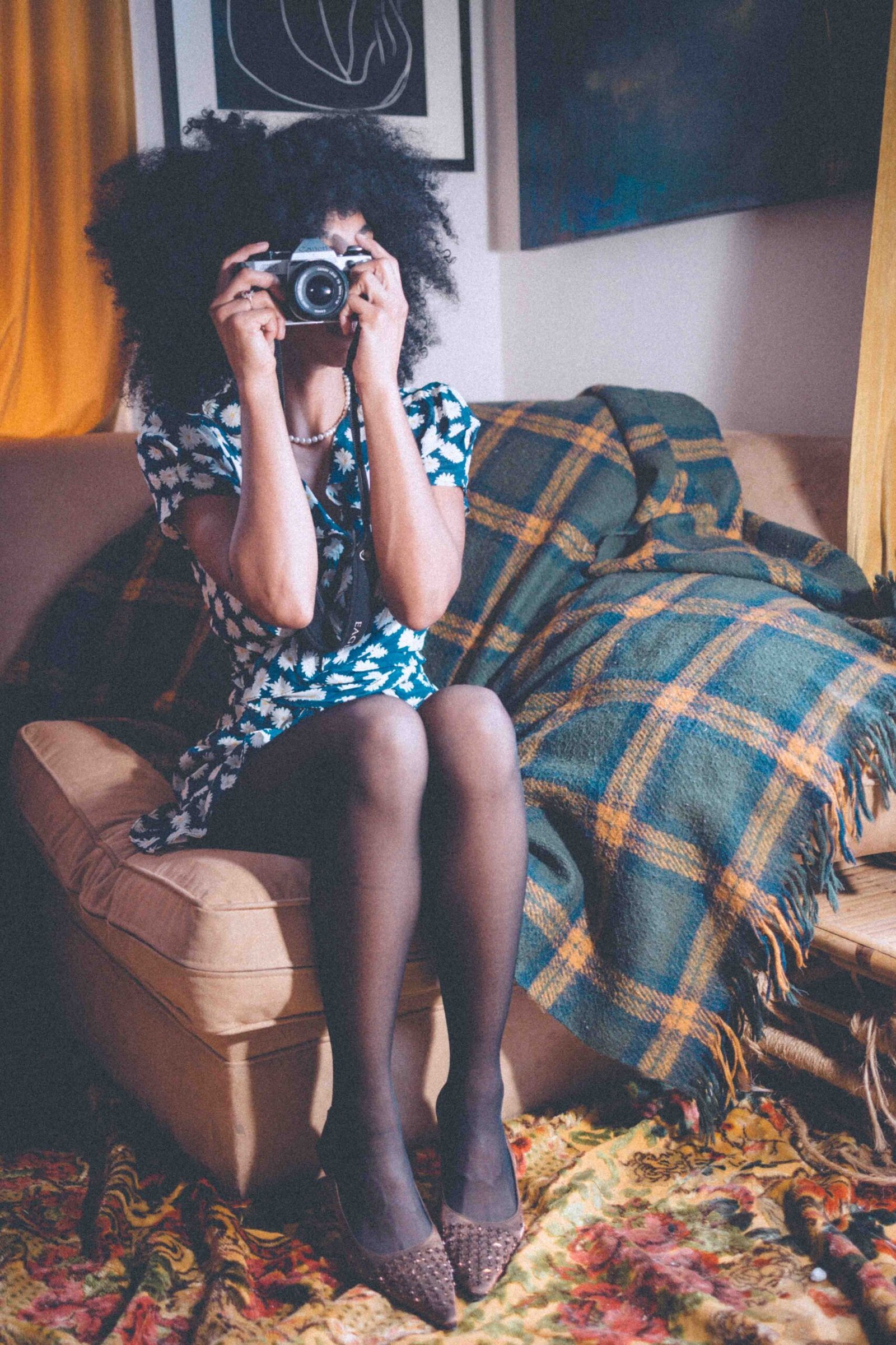 New York artist style in navy silk wrap dress with daisy print