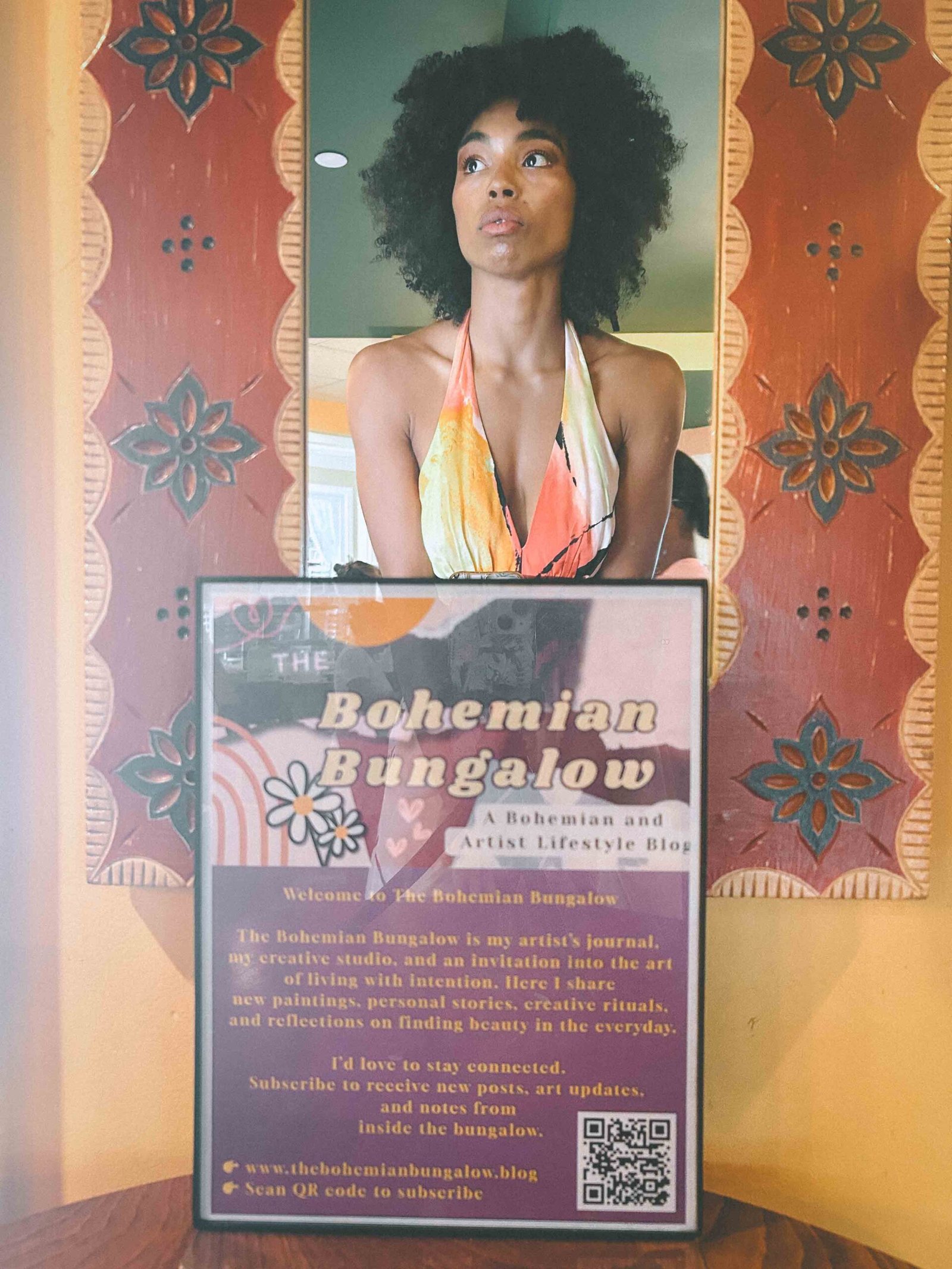 Artist portrait reflected in a mirror at the Bohemian Bungalow blog display during my New York art show.