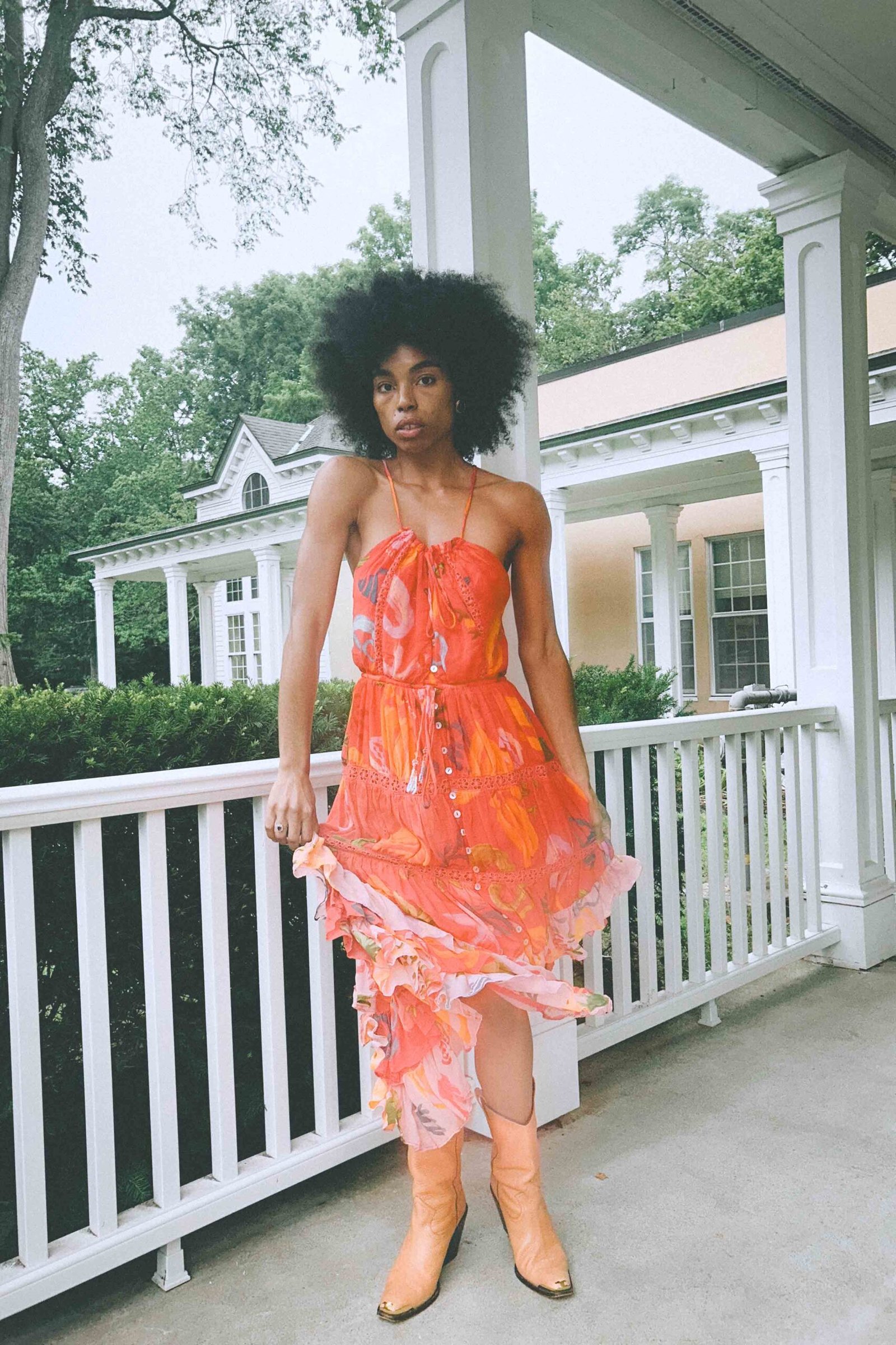 Orange floral Farm Rio maxi dress styled with cowboy boots, thrift store fashion find.