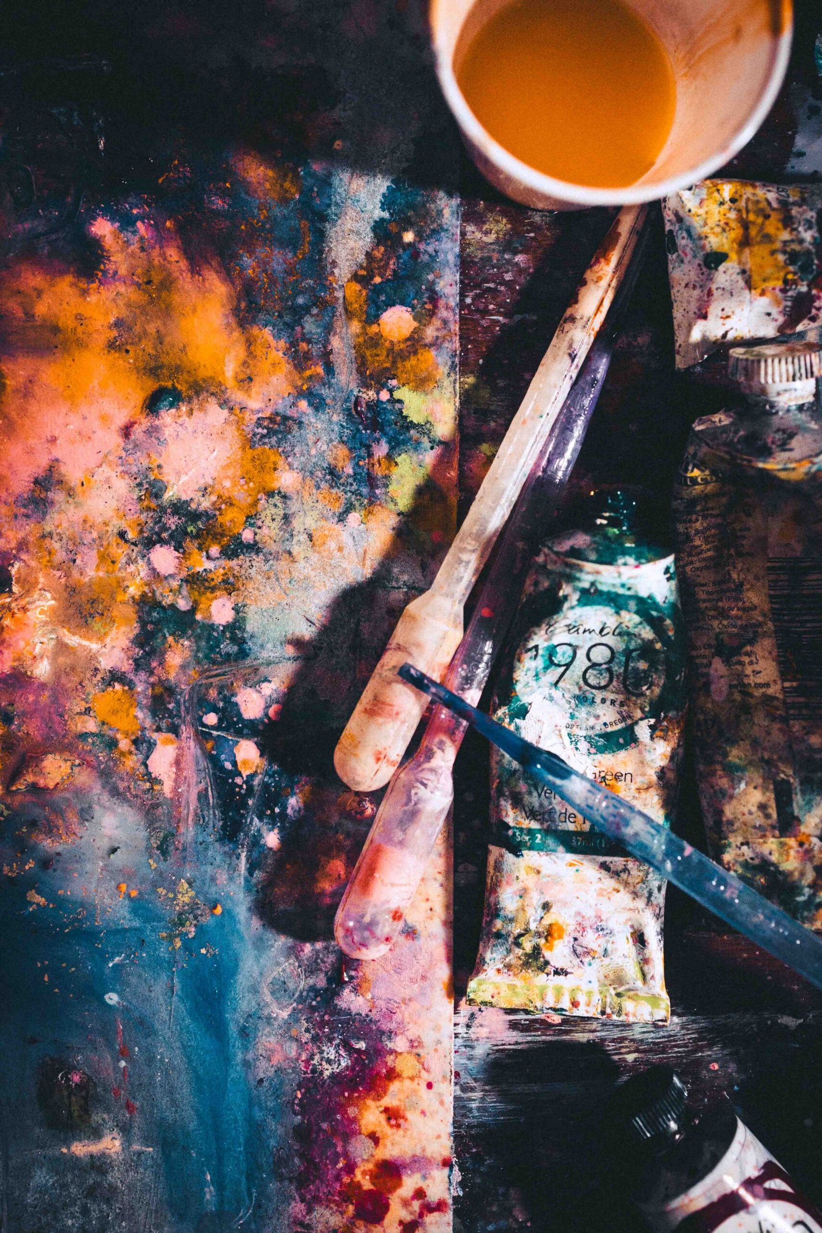 Messy abstract painting in the middle stage, representing painting as therapy and the emotional uncertainty of the creative process.