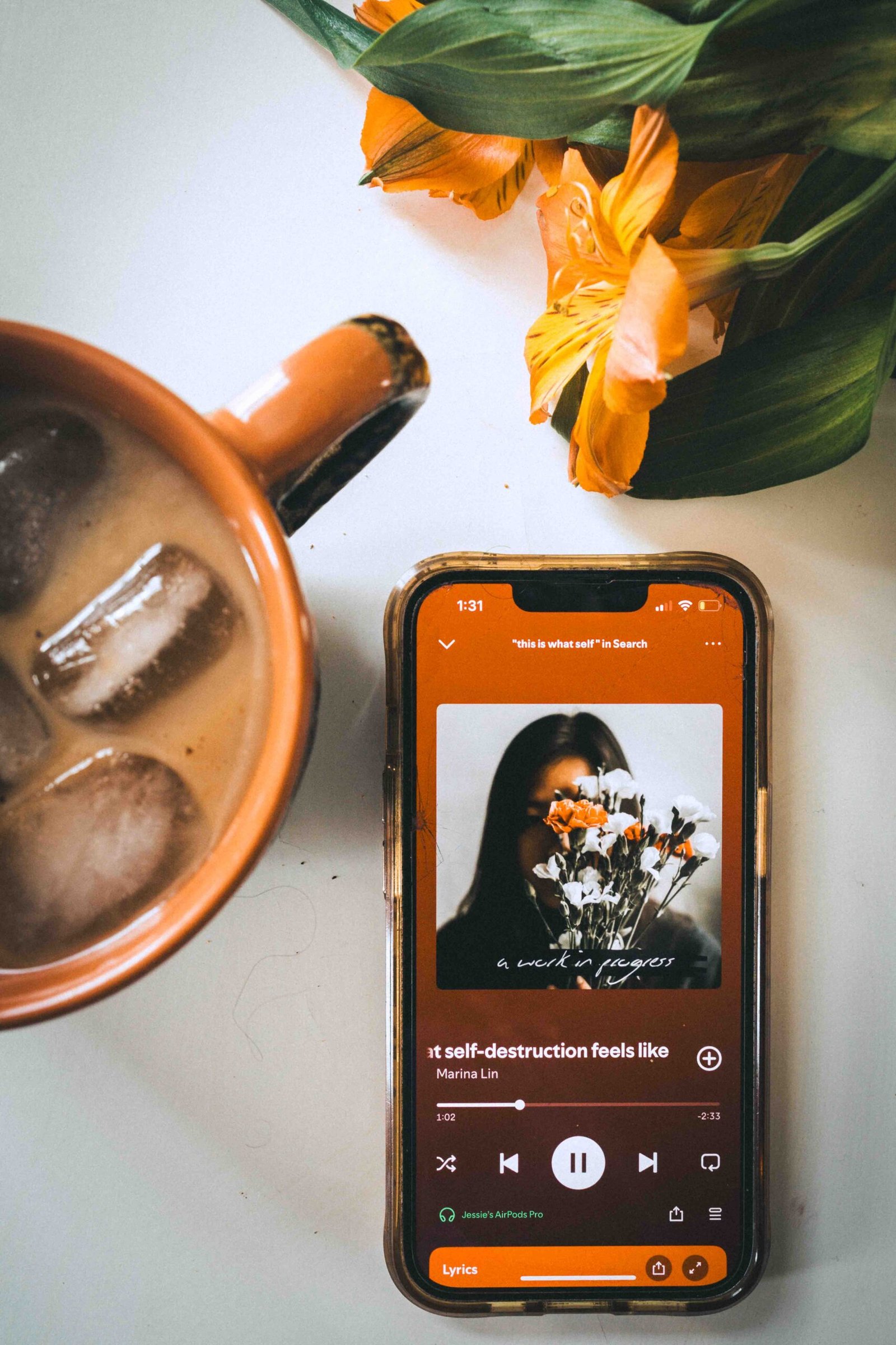 Creative ritual with coffee, flowers, and music, supporting painting as therapy through grounding and intentional studio routines.