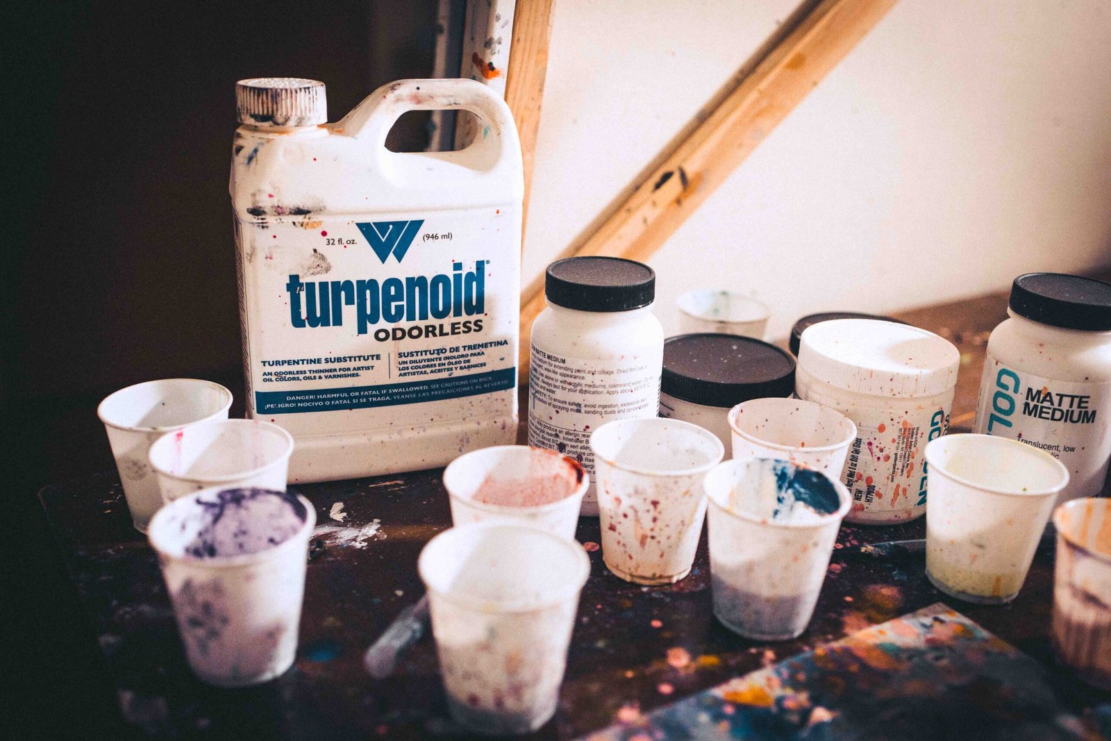 Close-up of oil paint being mixed with tools, illustrating painting as therapy through tactile, hands-on creative expression.