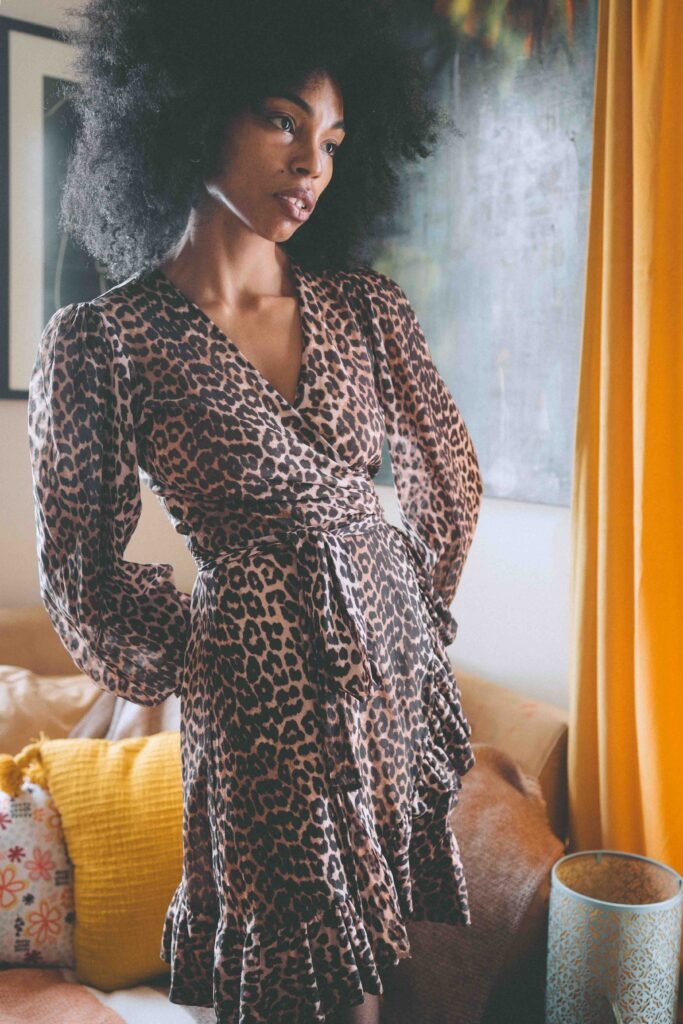 Self portrait at home wearing a leopard print dress, reflecting creative living and finding beauty in everyday rituals.