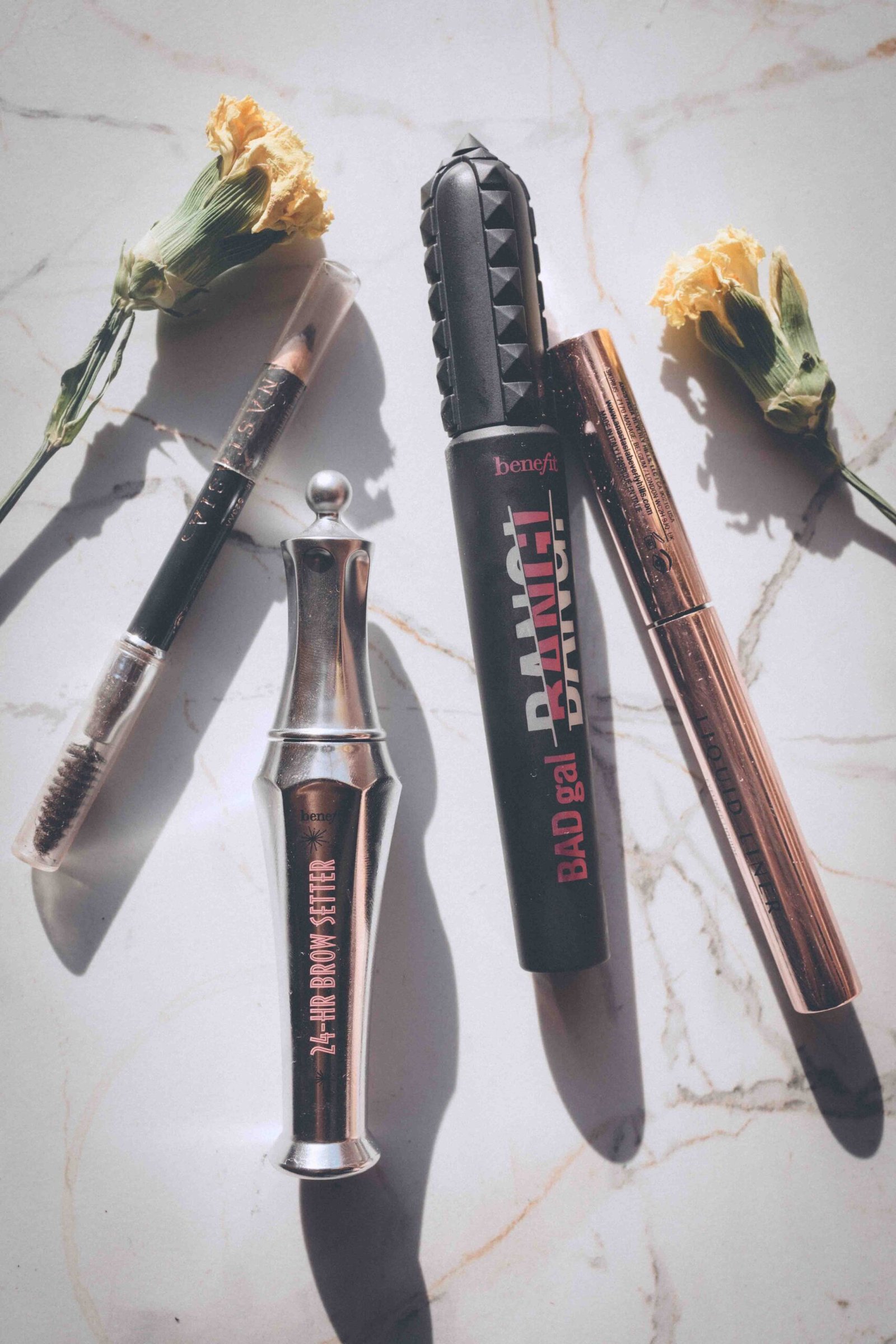 A small collection of makeup products arranged in sunlight as part of a simple beauty ritual.
