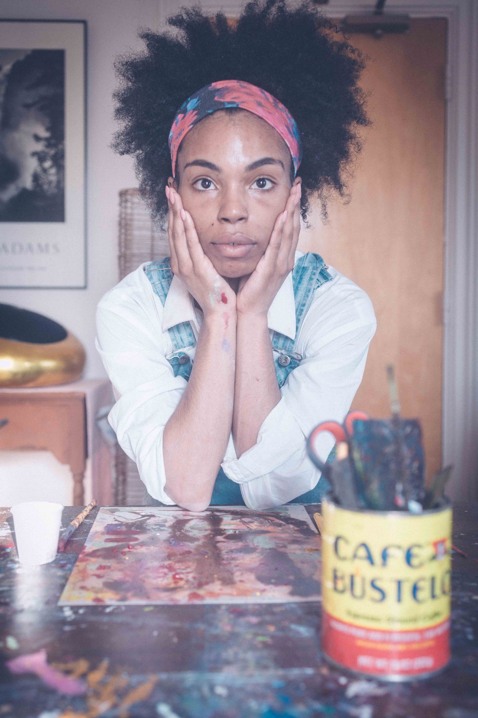 Artist looking at camera reflecting on creative burnout and rediscovering inspiration