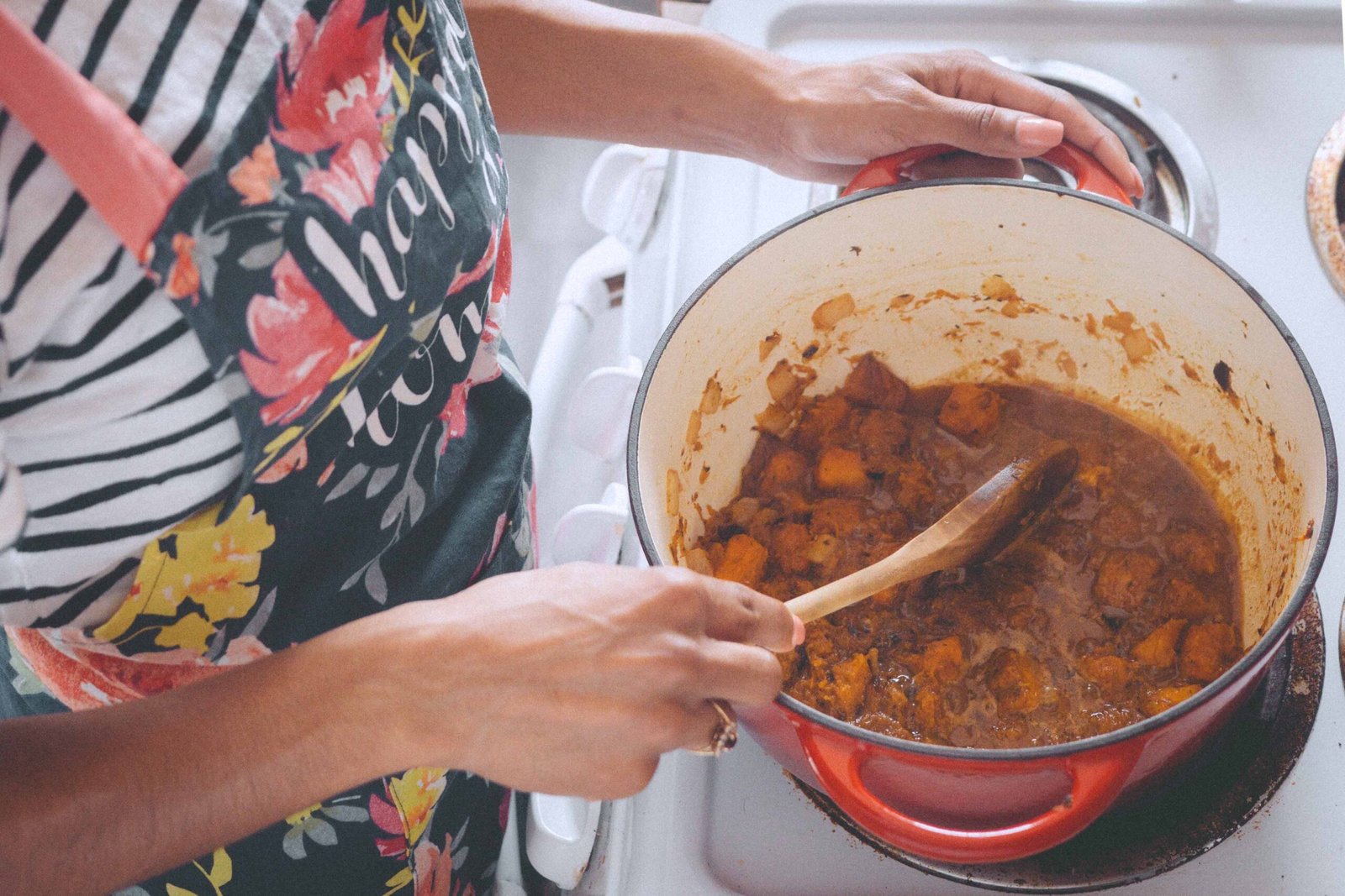 sautéing ingredients for butternut squash soup on the stove as part of a slow Sunday cooking ritual