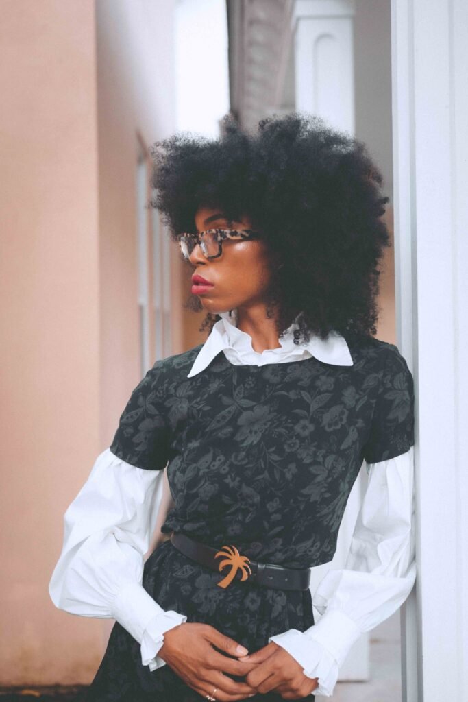 Portrait of a vintage Ann Taylor dark floral dress layered over a white poet blouse